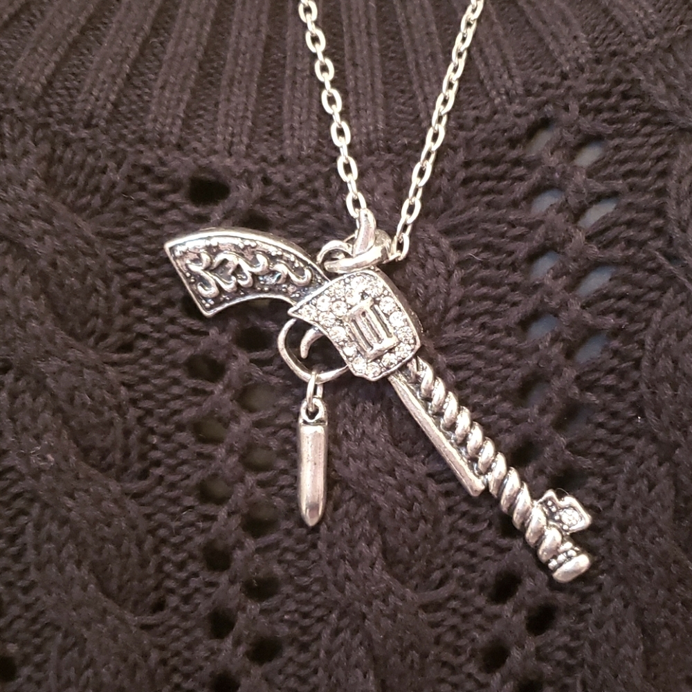 Pistol with bullet necklace